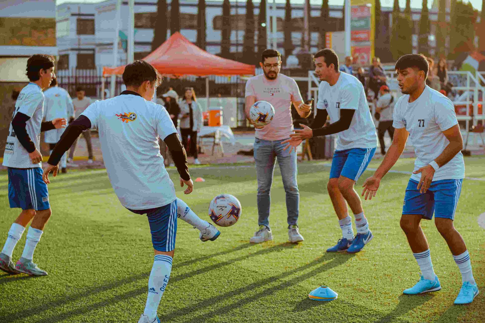 Football players training on field